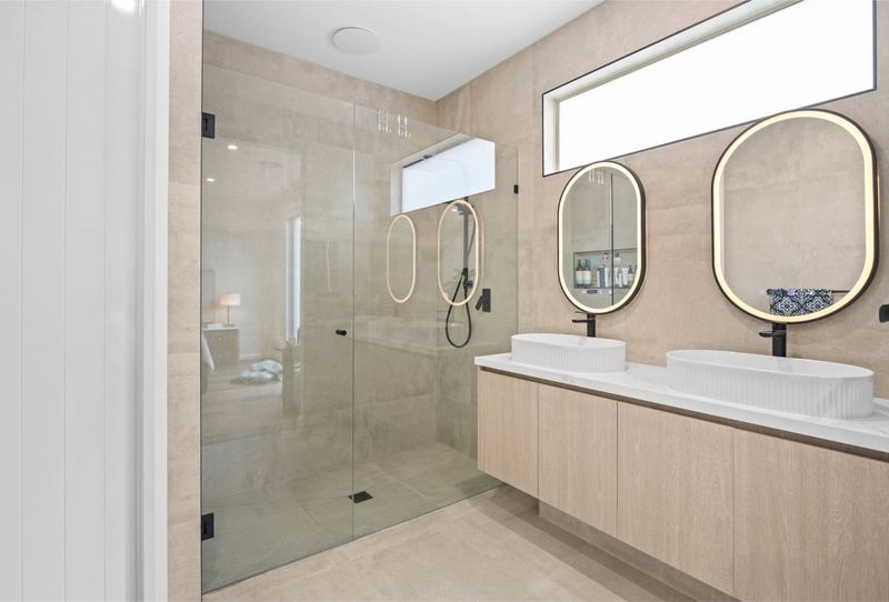 Ensuite double vanity with fluted basins and LED-lit mirrors