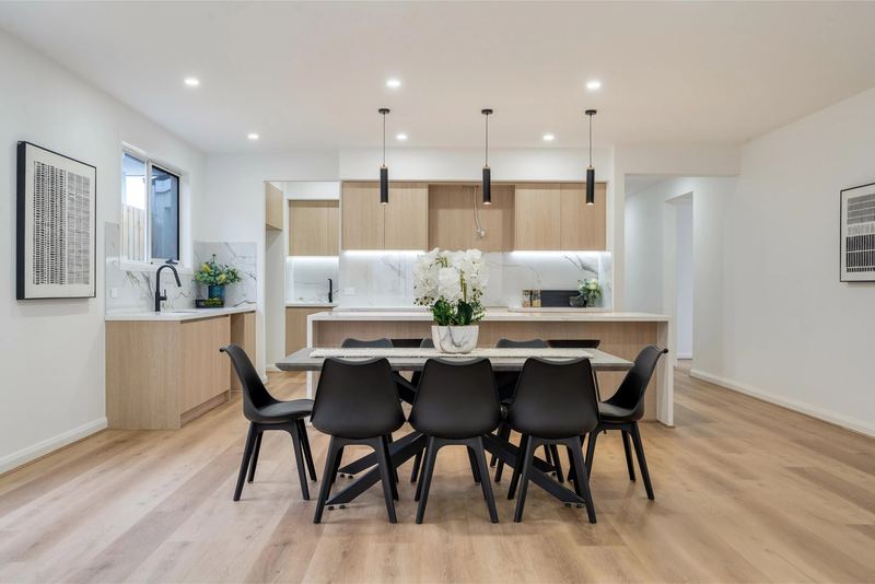 Open kitchen and dining area with pendant lights